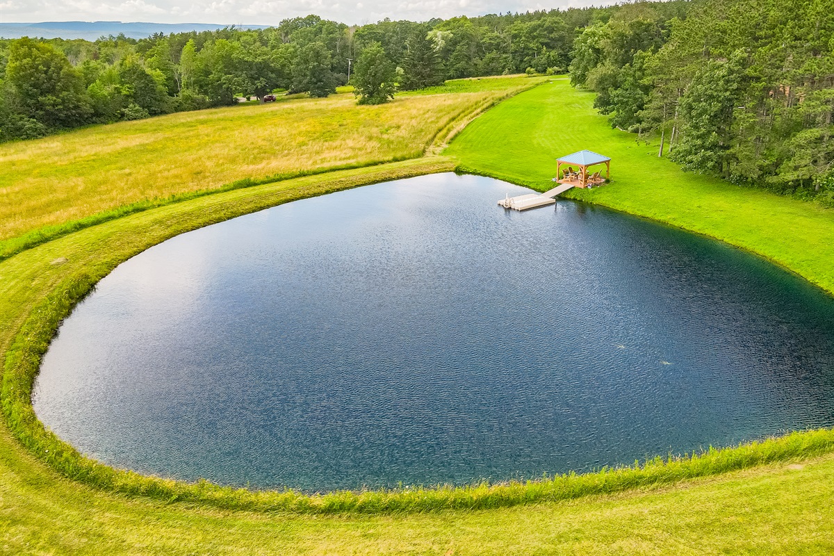 Tranquil waterside retreat featuring a dock and gazebo—ideal for morning coffee, sunset views, or lakeside gatherings.