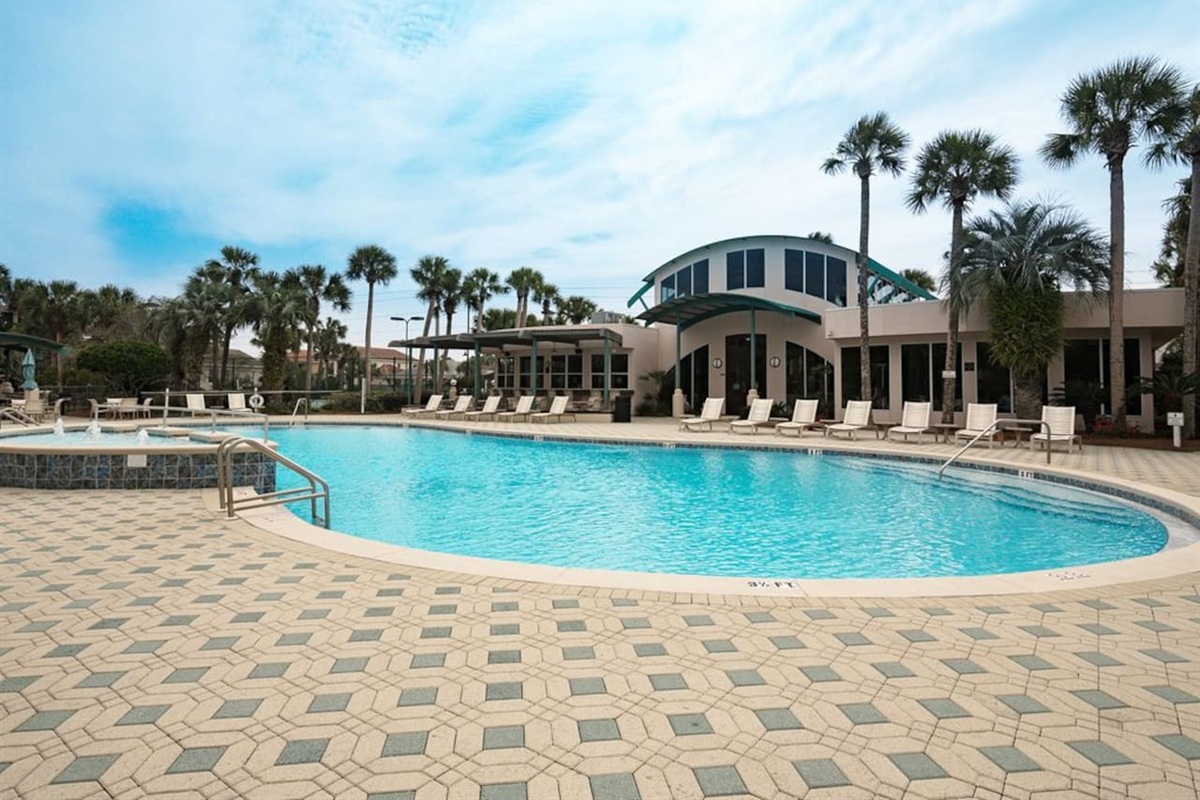 Club House Pool with loungers, tables, and plenty of seating