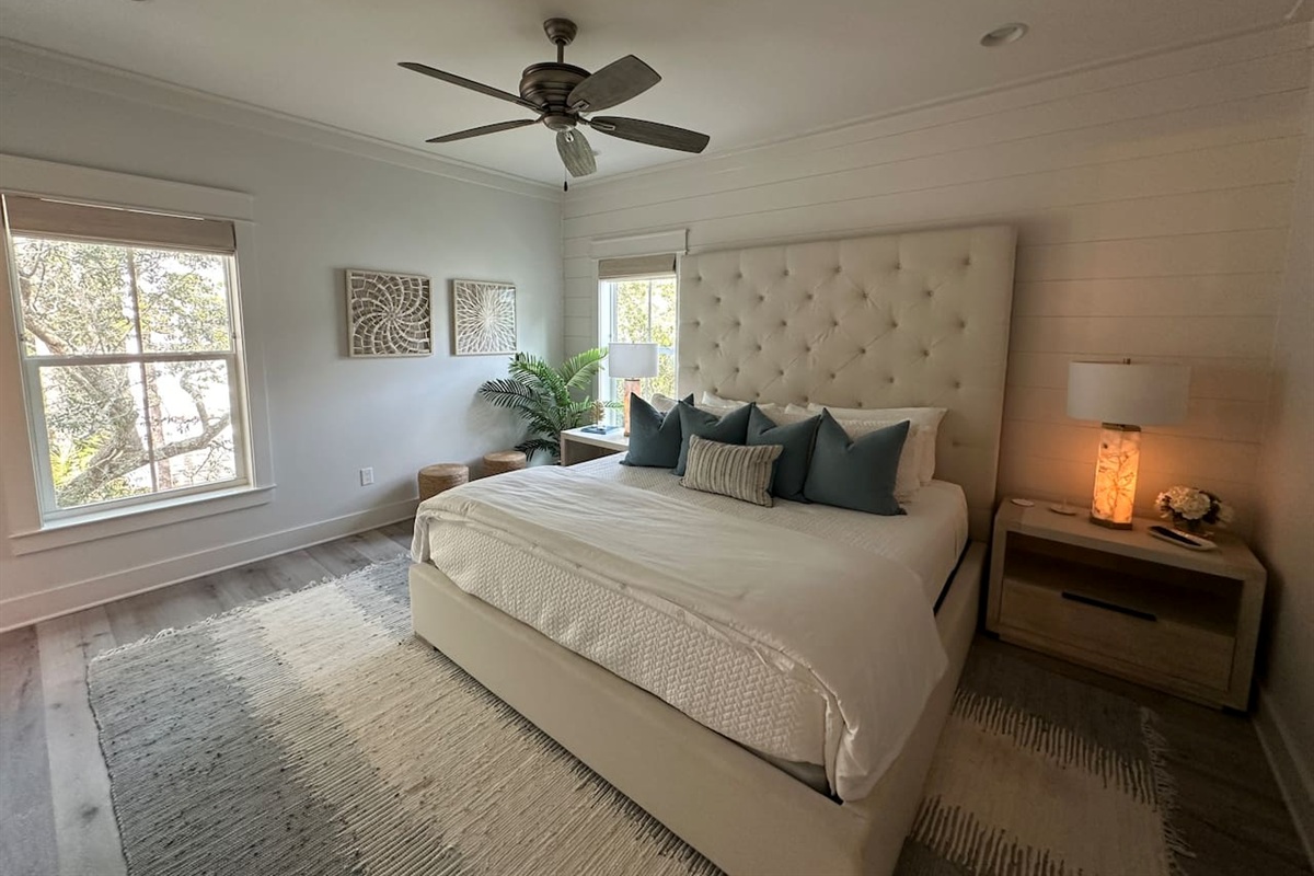 Spacious 2nd level king bedroom suite with full ensuite bathroom, tiled shower, dual vanity sinks, and newly remodeled outdoor shower.