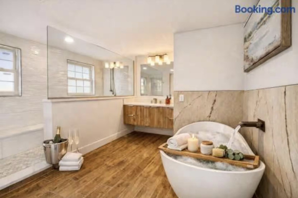 Luxury spa-inspired primary bathroom featuring a freestanding soaking tub