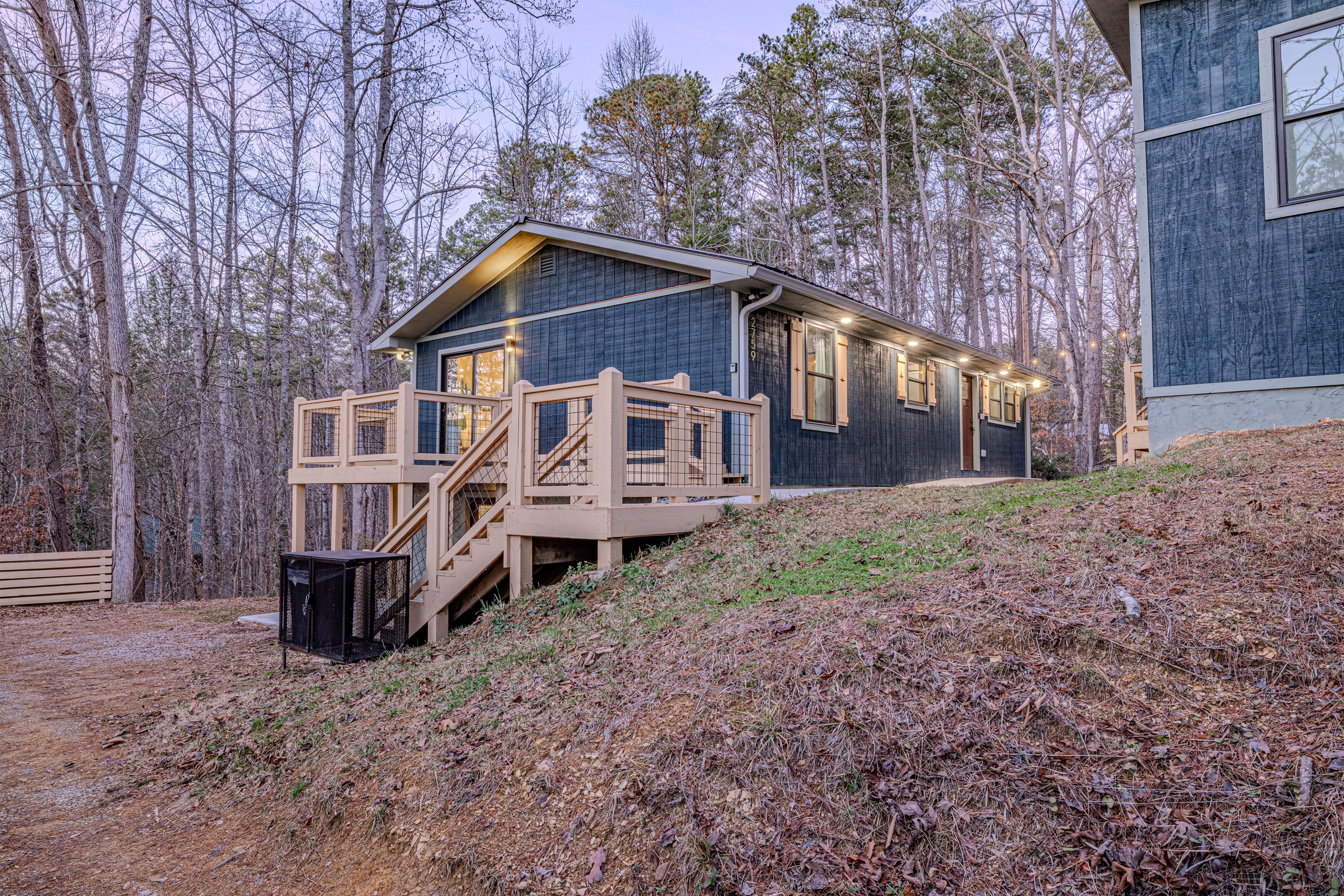 Find your peace on the deck, where modern design meets the tranquility of a lush, private mountain landscape.