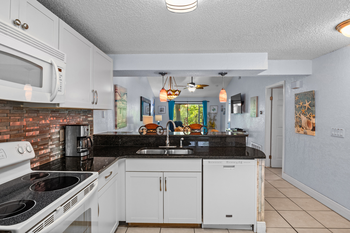 Kitchen sink & dishwasher. Connects to the dining area and family room.