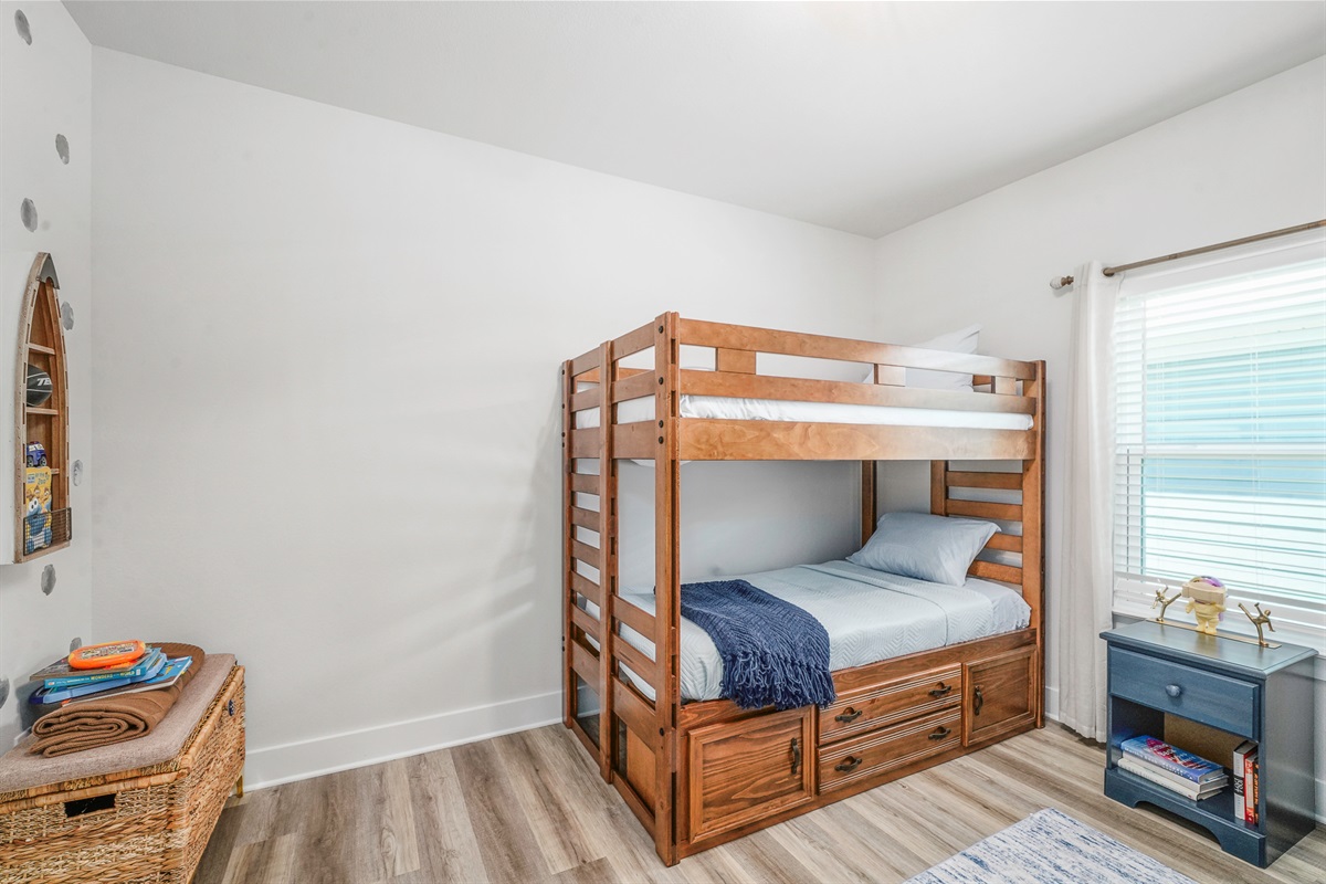 Bedroom 4: Kid-friendly bunk bed space with charming decorative touches throughout.
