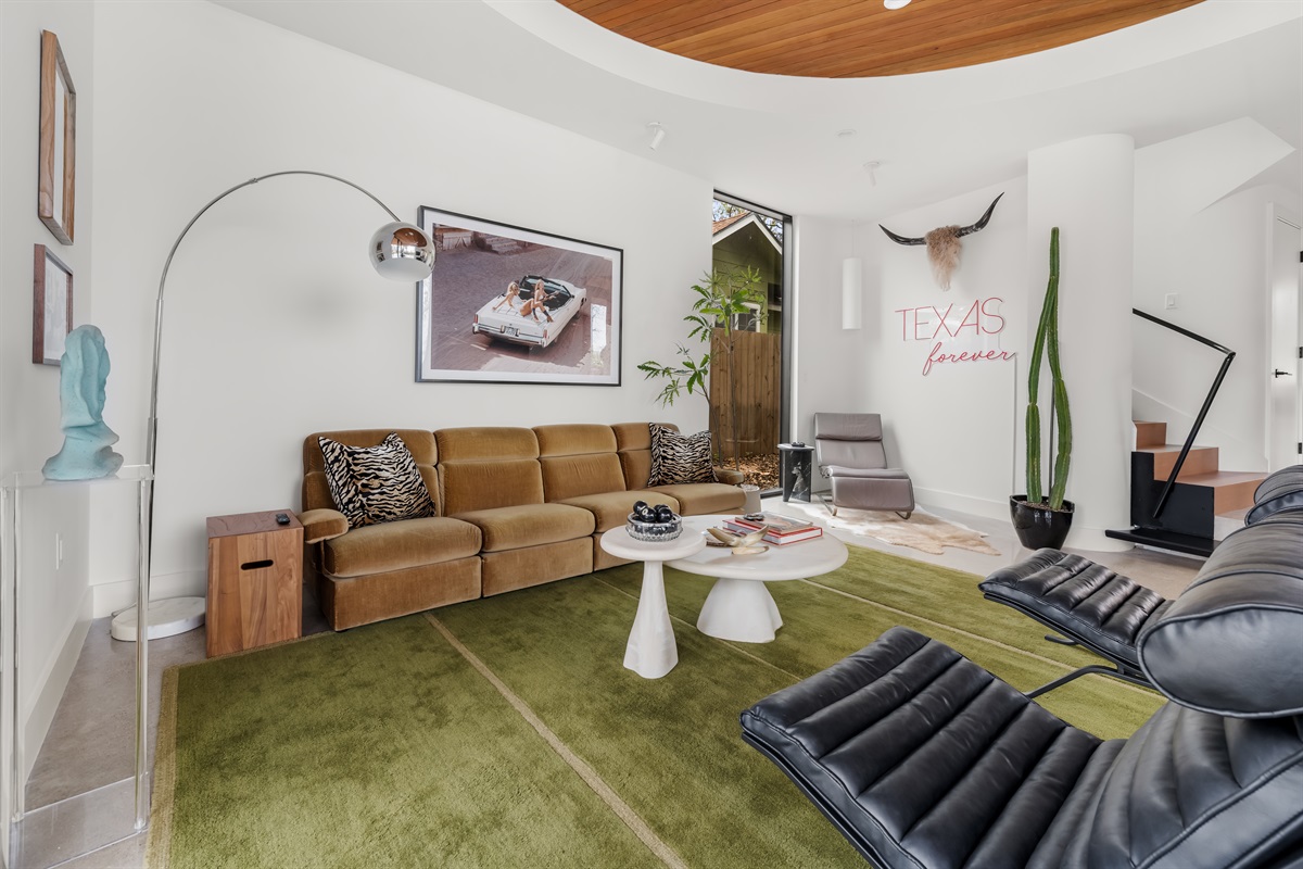 Modern living area with statement furnishings and plenty of room to unwind after a day in Austin.