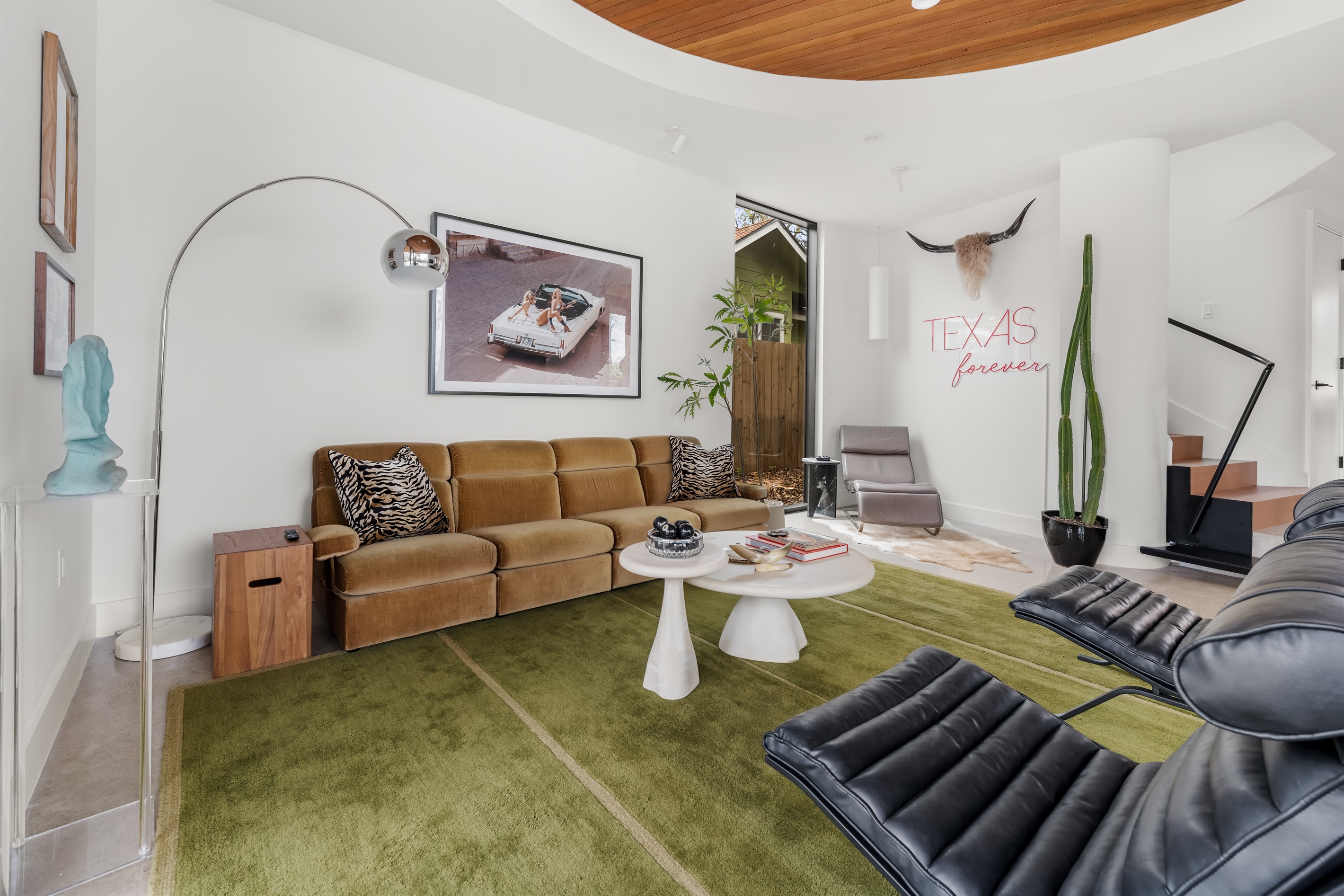 Modern living area with statement furnishings and plenty of room to unwind after a day in Austin.