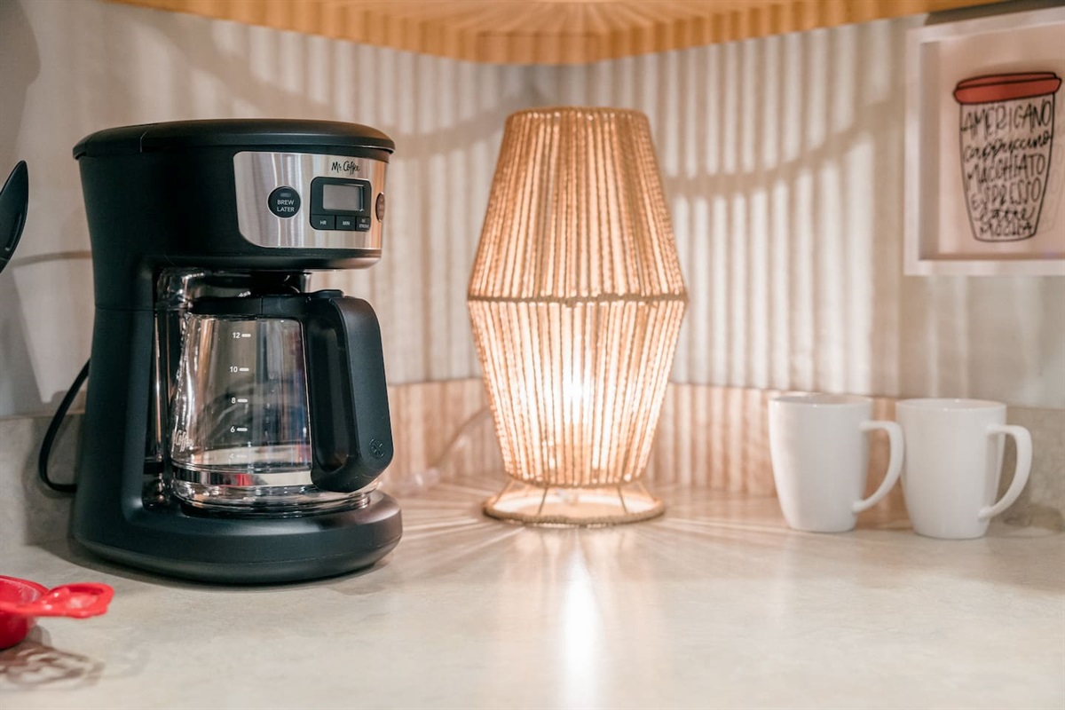 Mr. Coffee 12 cup drip coffee maker. Grinder available for fresh beans. Coffee and tea provided.