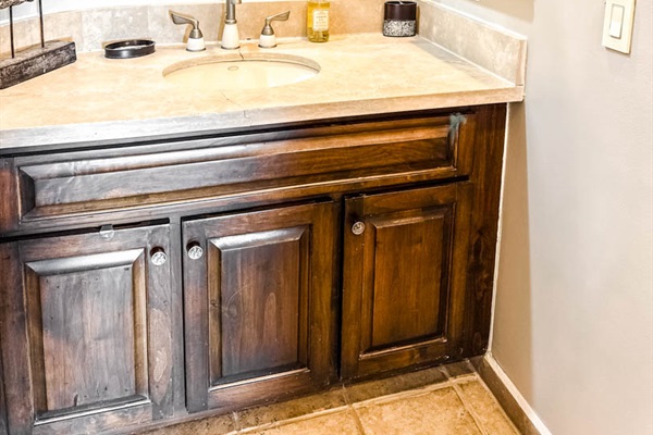 Spacious bathroom with soaking tub, walk-in shower, and single vanity.