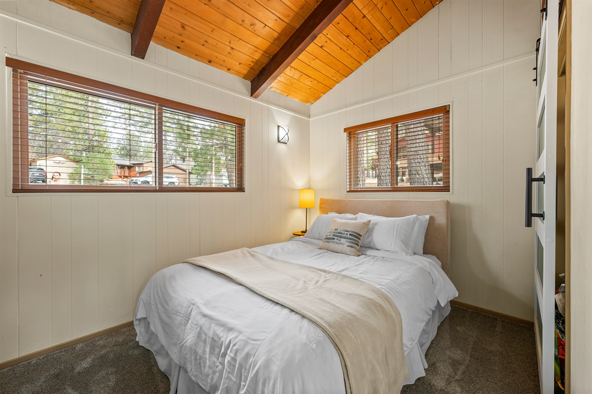 Queen sized bed with comfortable mattress. A luggage rack will hold your things, but let's be honest... you'll only be here to sleep with all of the adventure at foot!