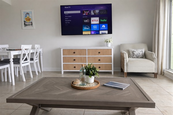 Bright coastal living room with smart TV