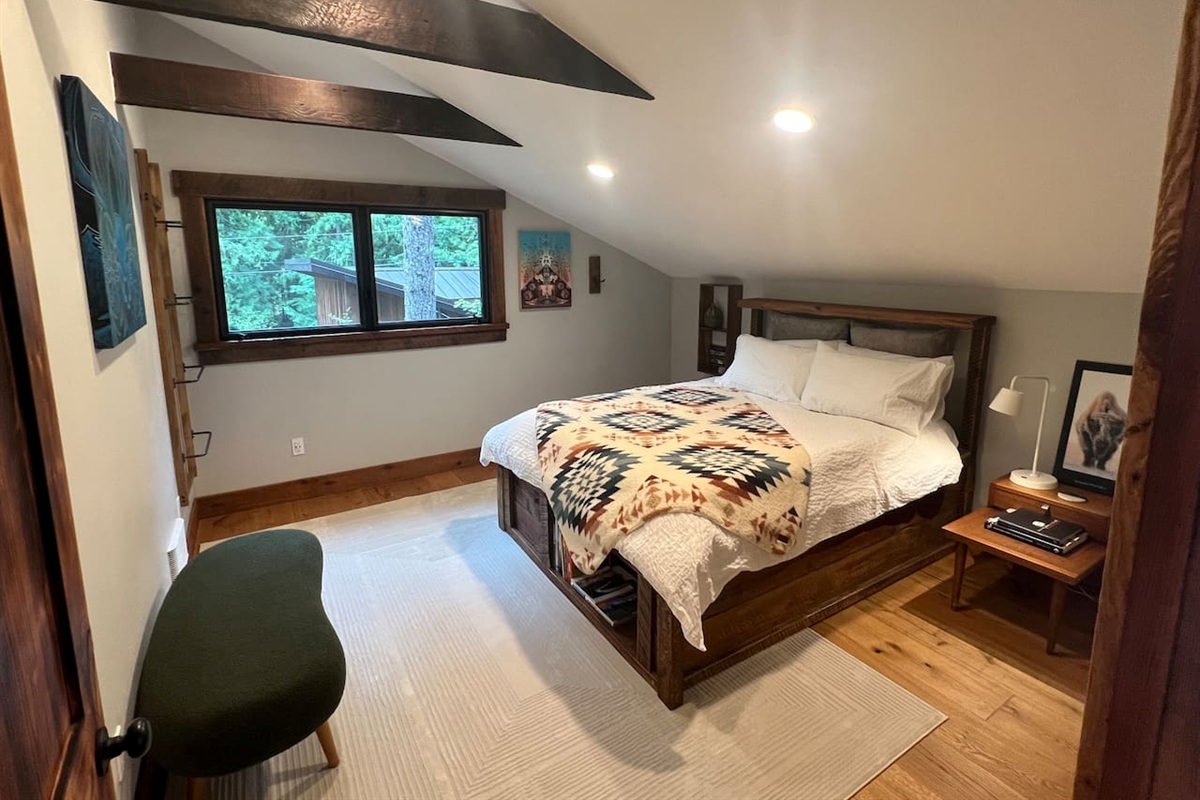 Queen bed guest room 1 with vaulted ceiling