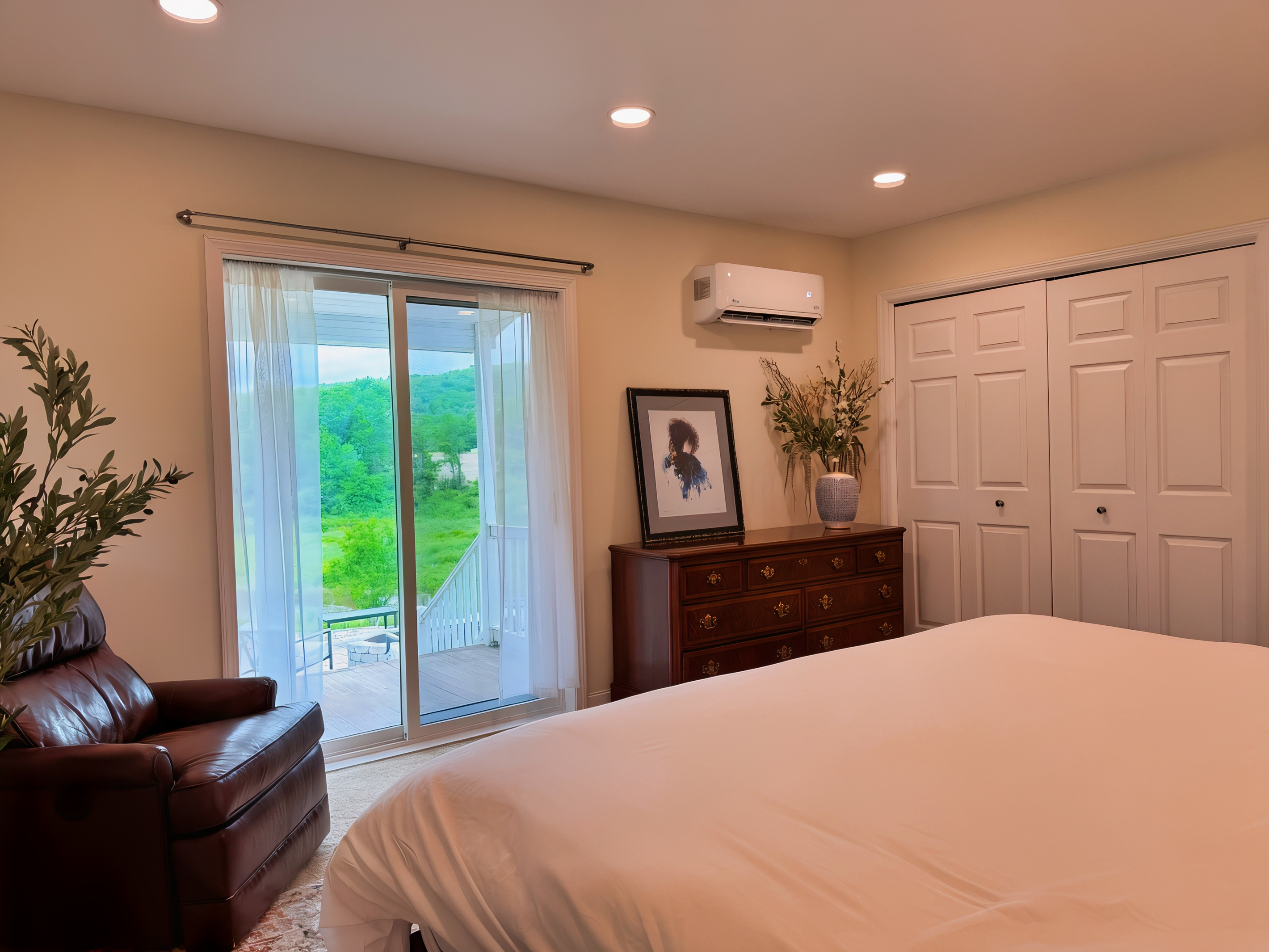 Lower level King Bedroom with sliding glass doors to a private sitting porch