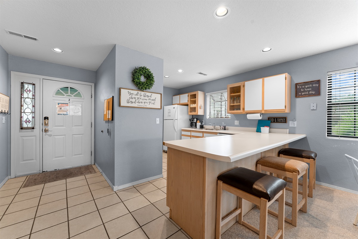 A simple, practical arrival zone flows right into the kitchen and main living area.