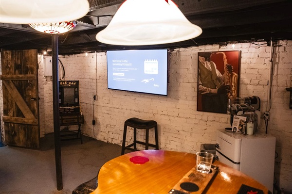 65" smart tv to watch the games or races, mini fridge, slushee maker, vinyl record player, pac man+++