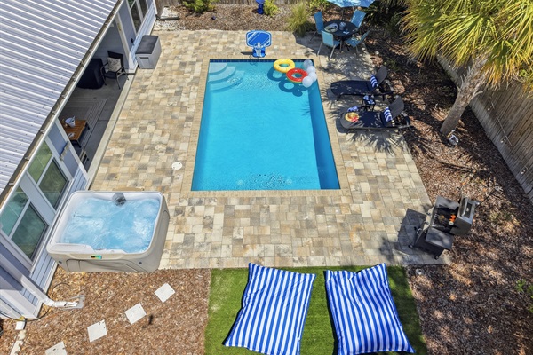 Relax on the pool deck with your favorite beverage, and watch friends and family play the day away in the pool with floats, basketball, masks and more, or simply hang in the hot tub and soak for the evening.