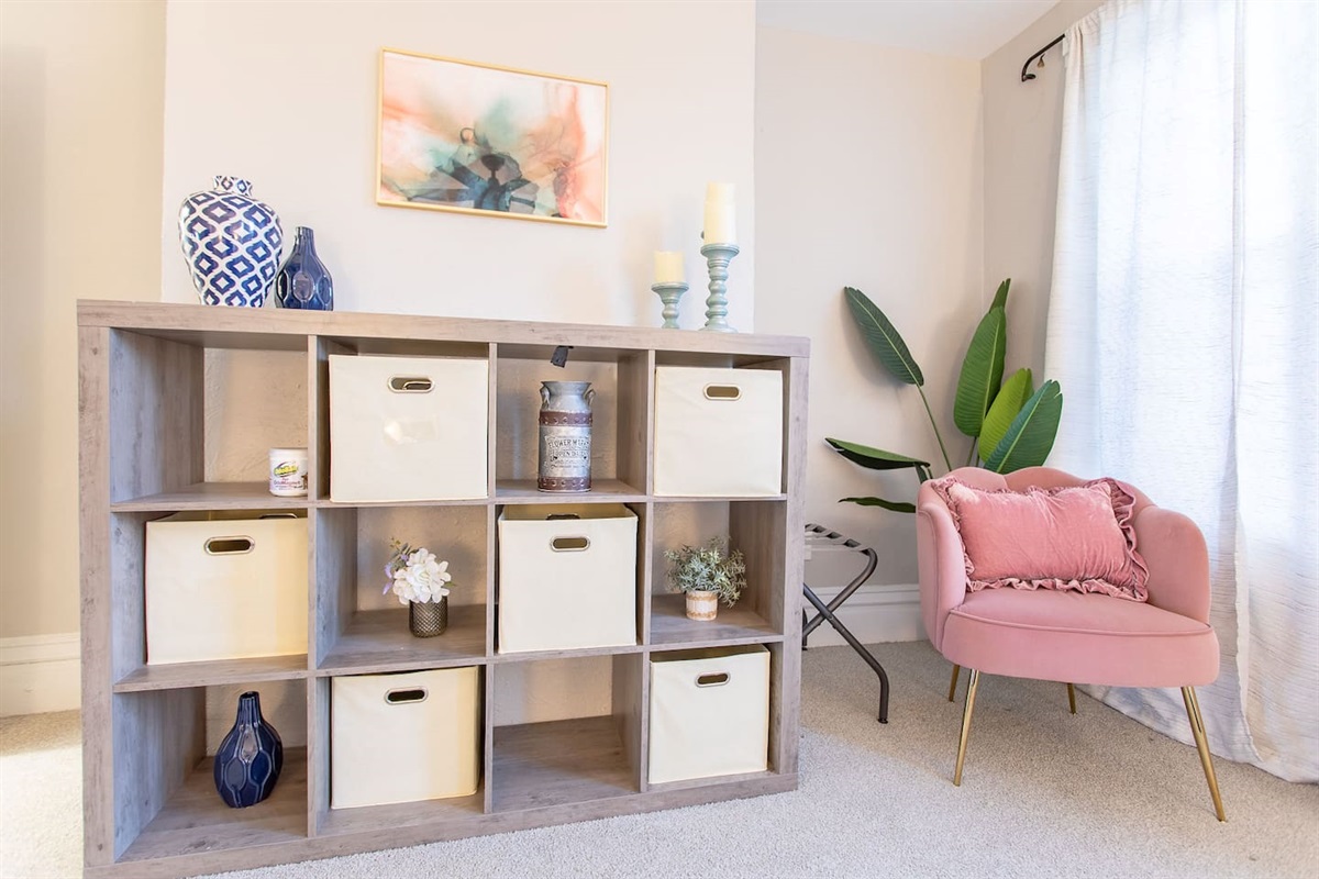 In the King Bedroom, store your belongings in the dresser and cubbies with baskets in the cube storage unit.