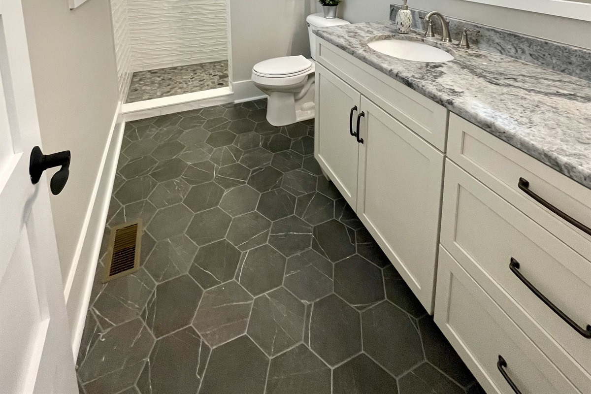 Primary bedroom bath with walk-in shower and plenty of storage