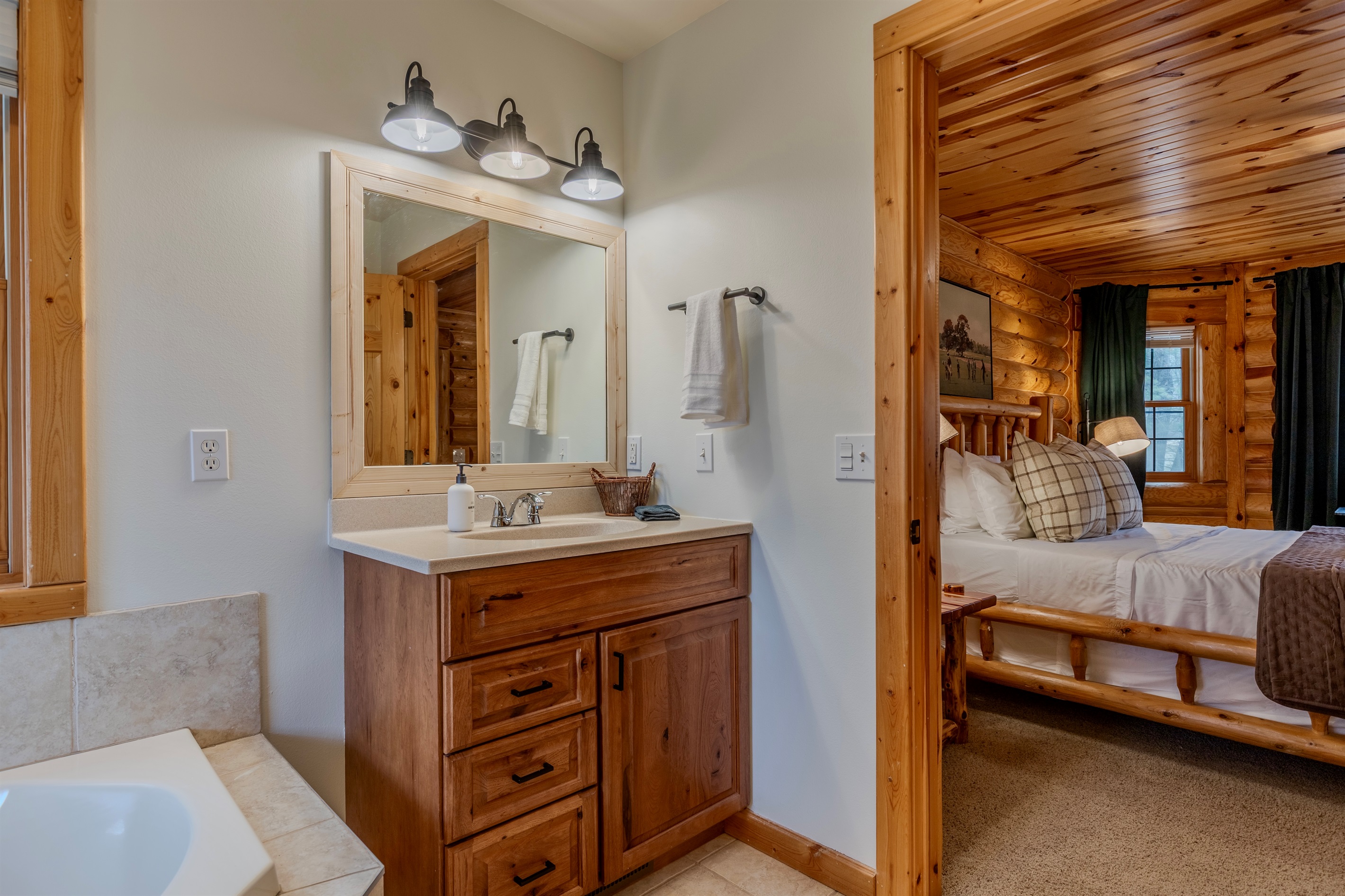 Master Bedroom ensuite with soaking tub & shower.  Shampoo, conditioner and body wash are provided during your stay.