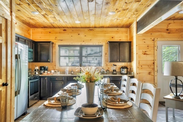 Fully equipped gourmet kitchen with a spacious range, dual-function coffee maker, and elegant decor, perfect for culinary enthusiasts.