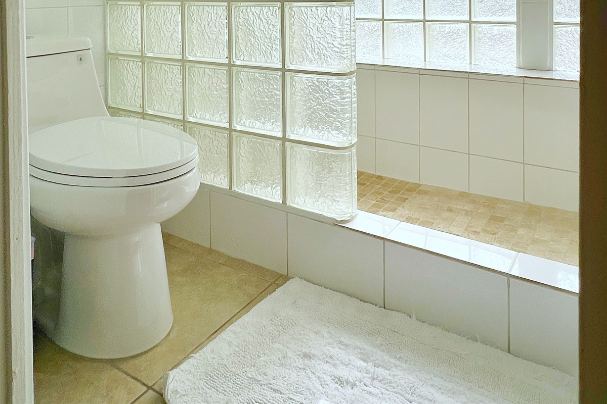 Clean lines and simple elegance make these bathrooms both functional and inviting.