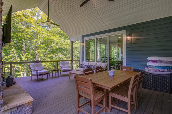 Main level deck seating area and dining table