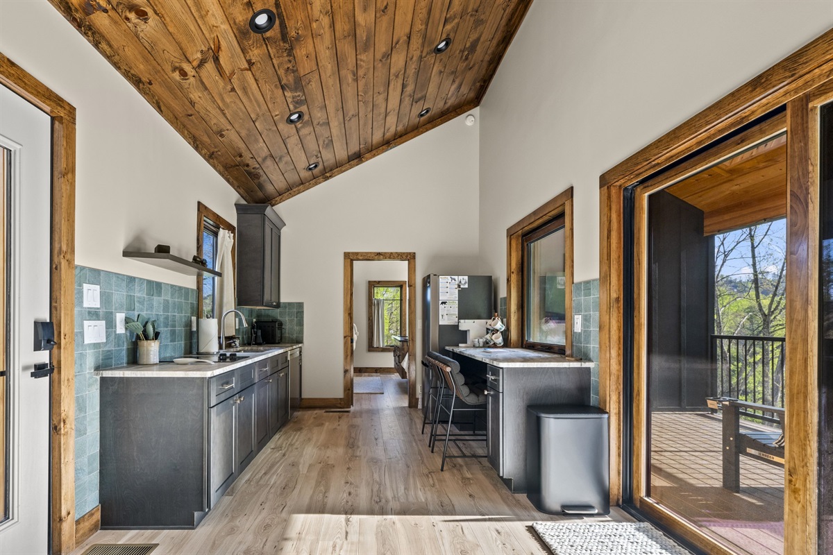 Combined kitchen and living room with easy access to the deck