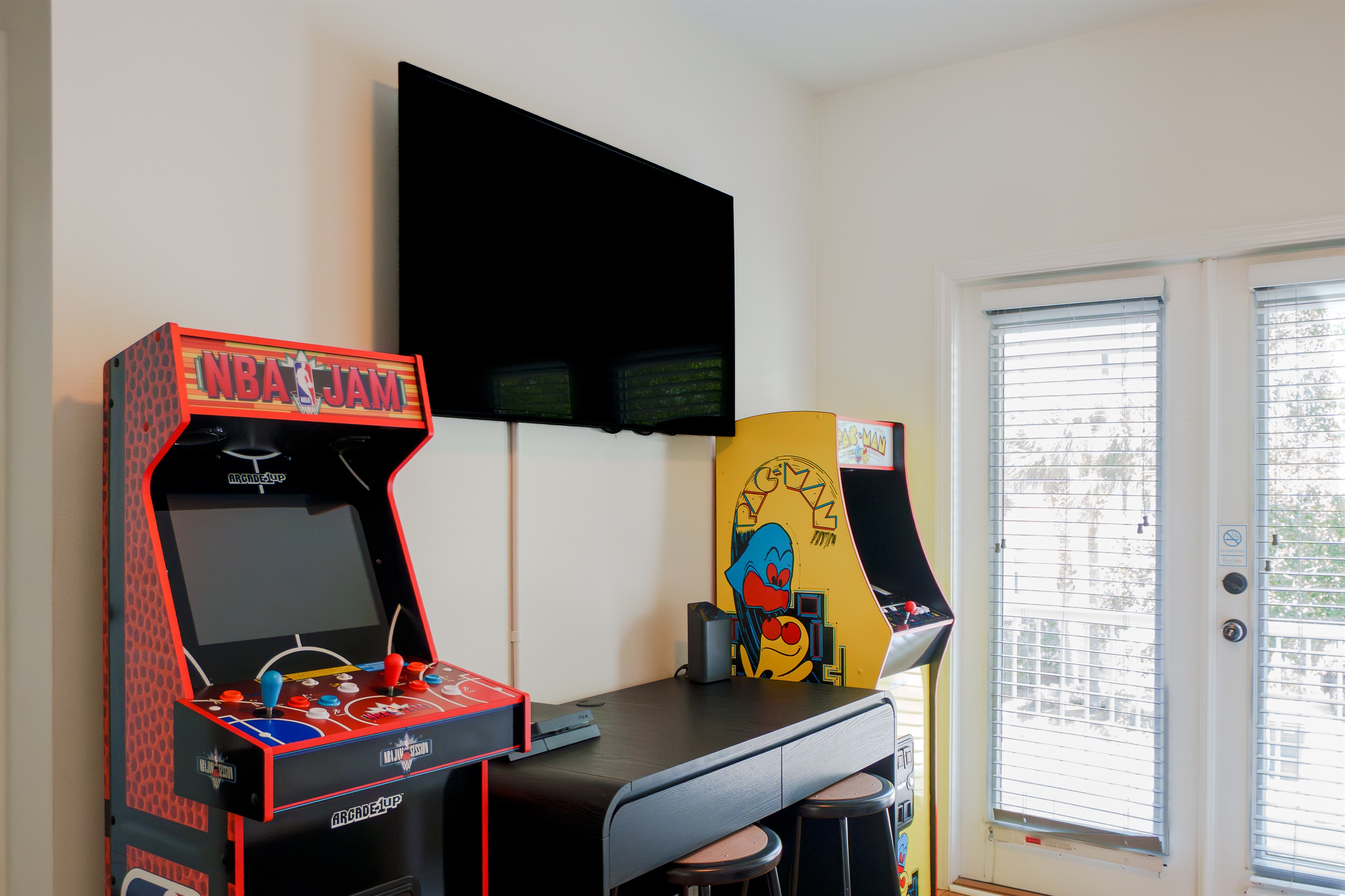 The loft has arcades, gaming console, TV, a twin daybed, and direct access to the balcony, a fun bonus space that works great for kids or teens who want their own hangout.