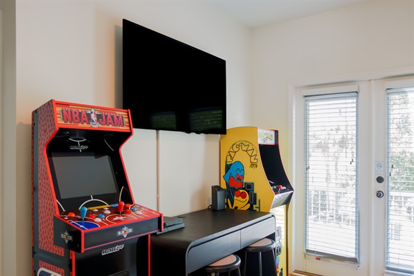 The loft has arcades, gaming console, TV, a twin daybed, and direct access to the balcony, a fun bonus space that works great for kids or teens who want their own hangout.