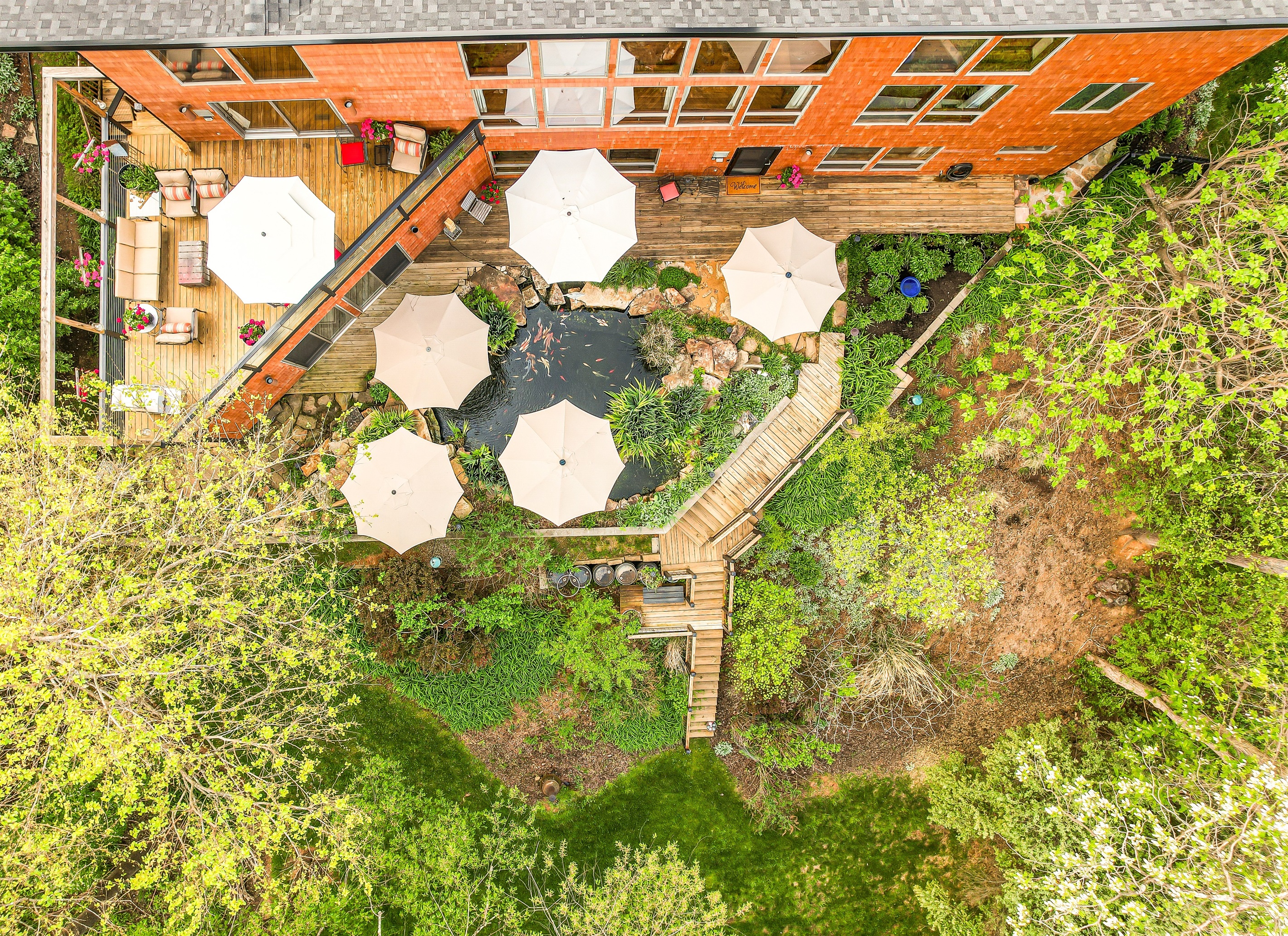 Our private, treed backyard is a multi-level retreat. Relax by the 7,000-gallon koi pond, enjoy the sun, or nest under an umbrella. Find a quiet spot  on the lower dec or bottom lawn. A perfectly secluded hideaway in the heart of Abingdon.