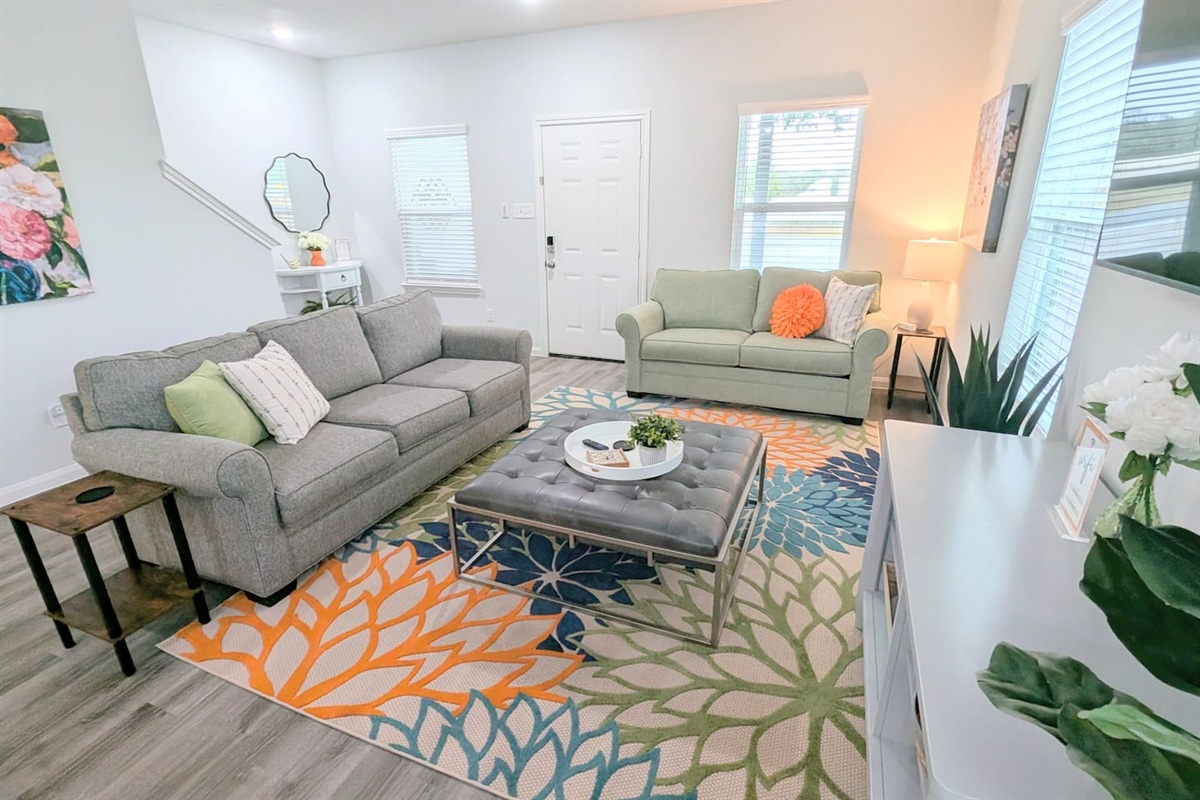 Watch TV, play a game, or have a cozy conversation in this spacious living area. 