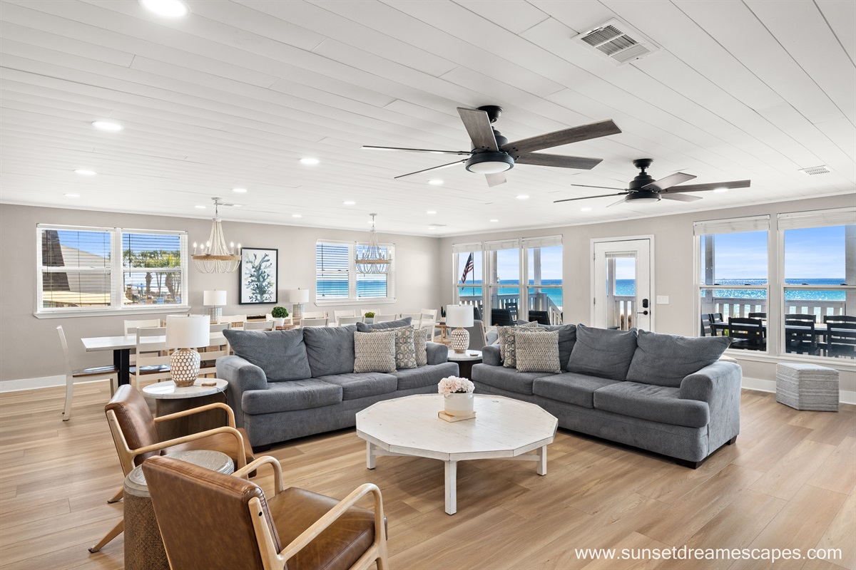 With gorgeous views of the Emerald Coast, your guests may spread out in comfort in the living room, dining room, kitchen, or rocking chair areas of the large keeping room.