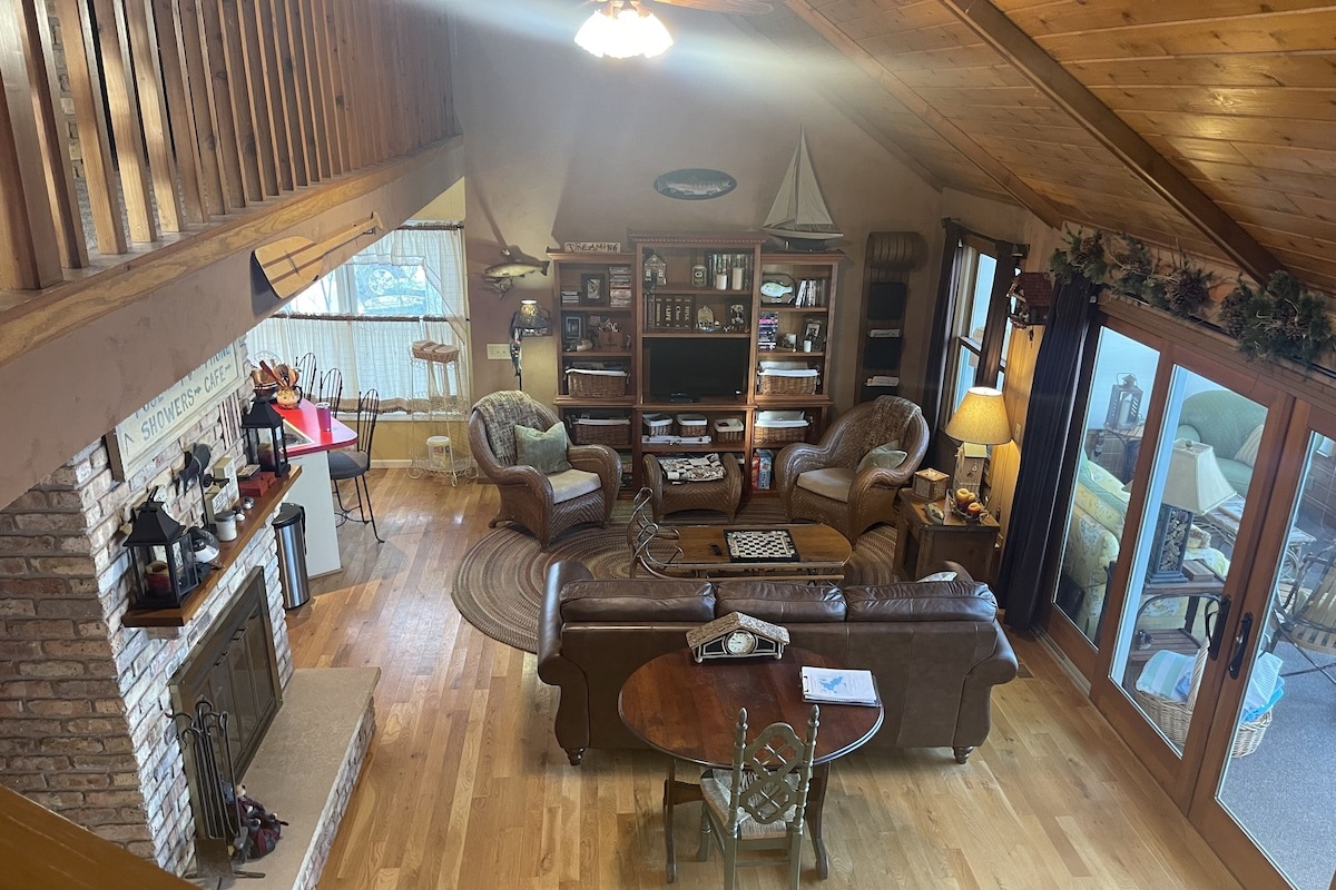Living room with fireplace and access to sunporch and patio