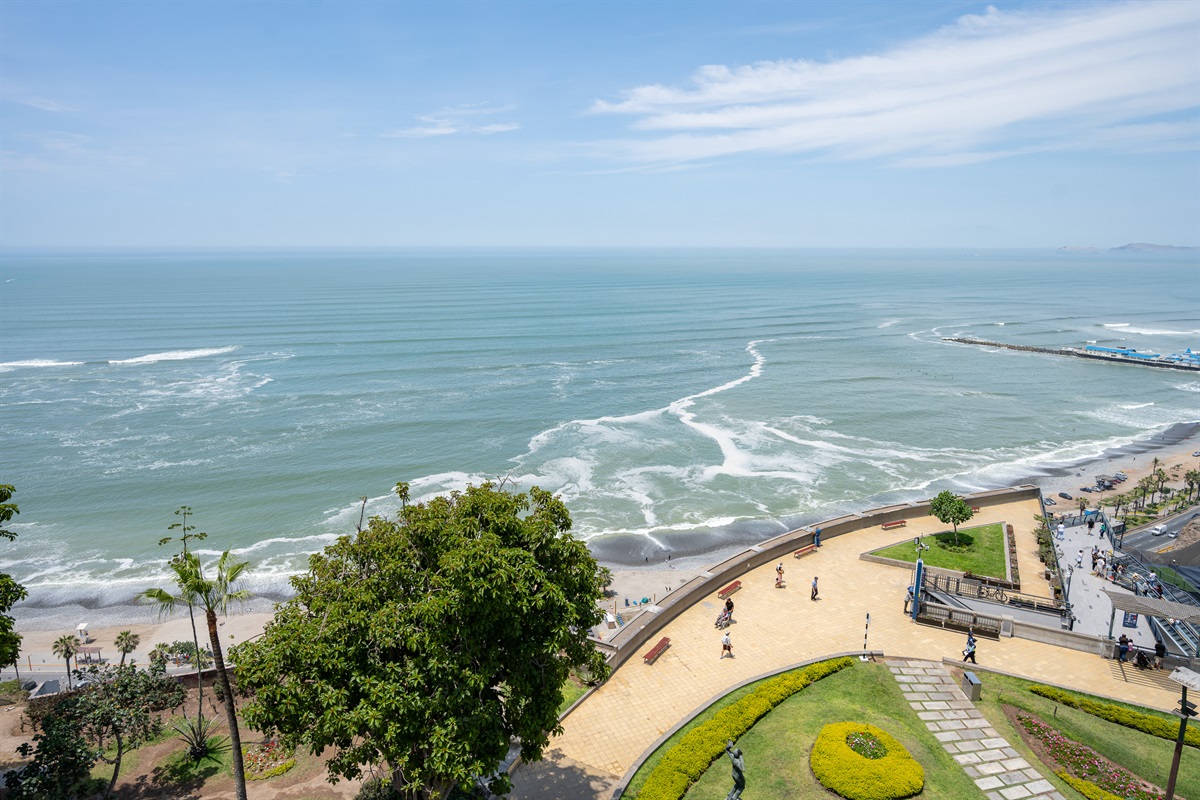 View from the living room and balcony to the Malecón and the Pacific Ocean — a postcard-perfect moment every day.  (Photo taken from apartment balcony)