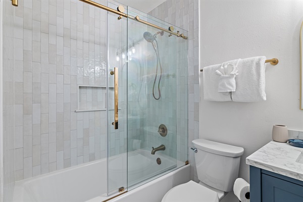 Beautiful brand new hallway bathroom with full bathtub and shower! Custom tile, sliding glass door, modern finishes. 