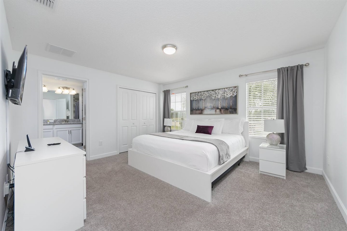 The master bedroom with a king bed, ensuite bathroom and TV, is upstairs