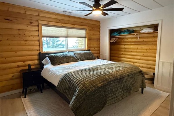 Bright and cozy bedroom with a king bed, perfect for couples or guests looking for extra comfort and space.