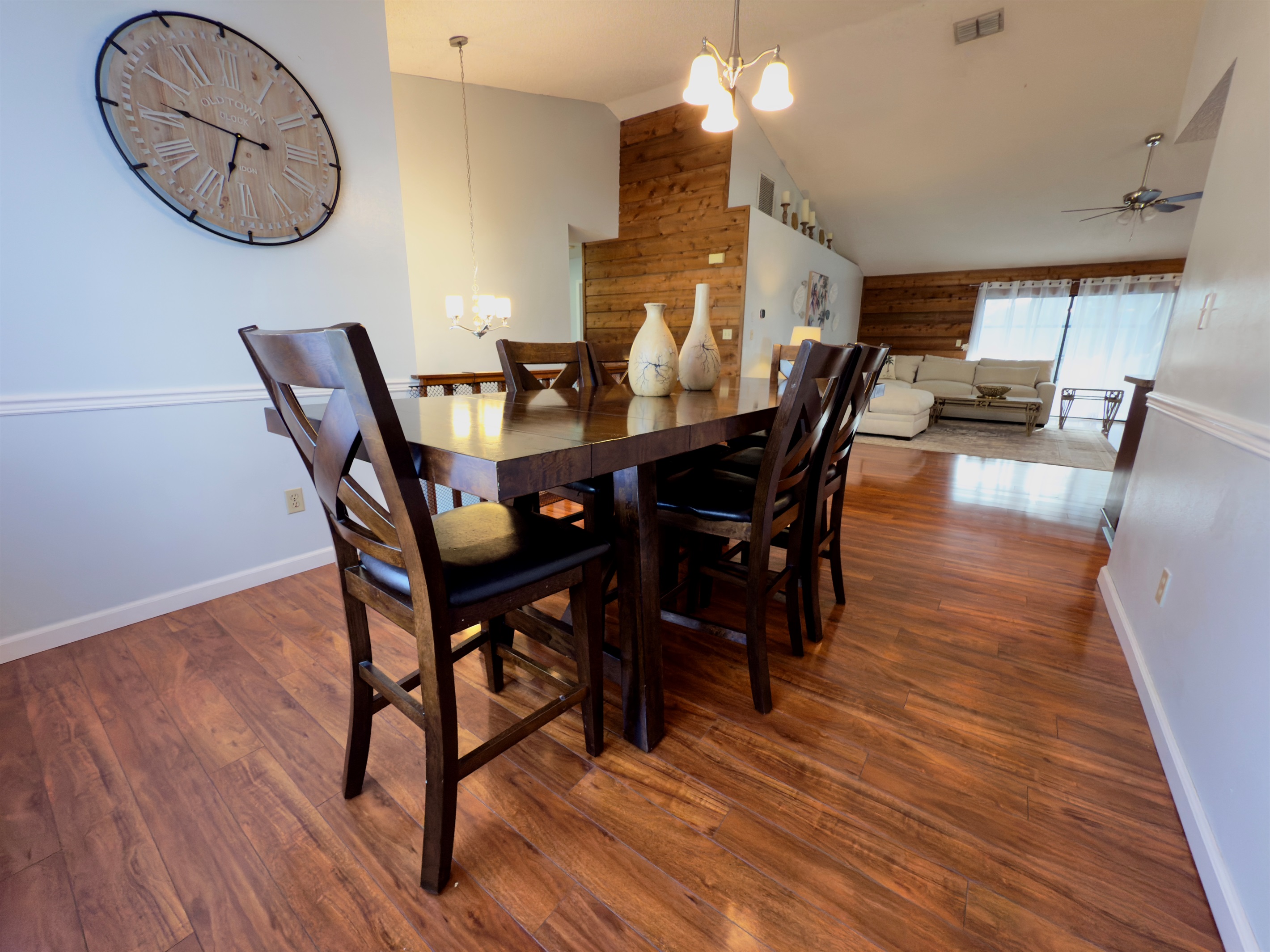Set against a backdrop of warm wood floors and soft neutral tones, this space seamlessly blends rustic character with modern elegance.