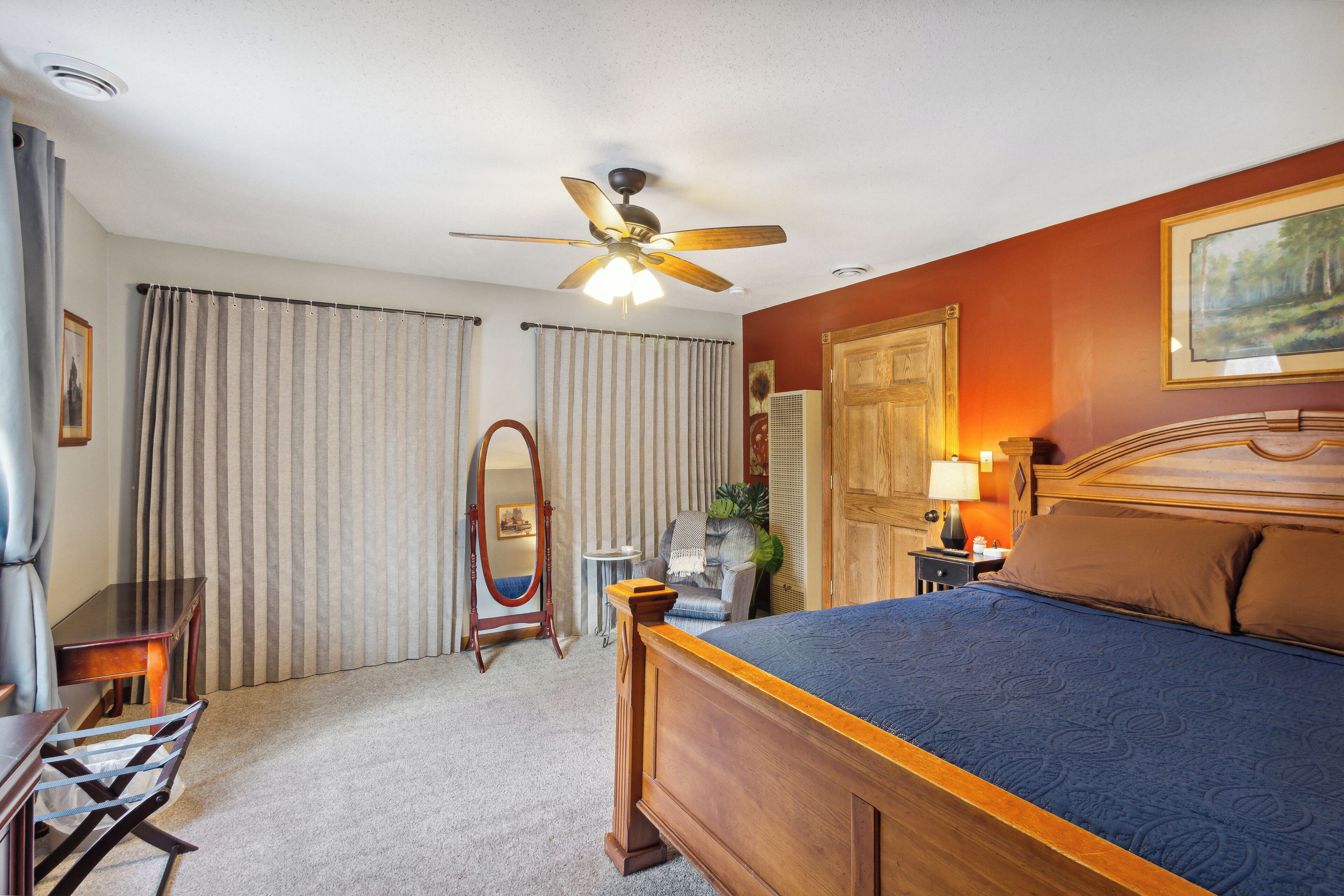 Master bedroom with a king size bed, and ton of closet space.