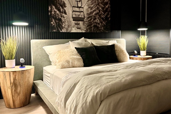 Acoustic wood and felt slats surround the king bed to make for a comfortable and quiet environment 