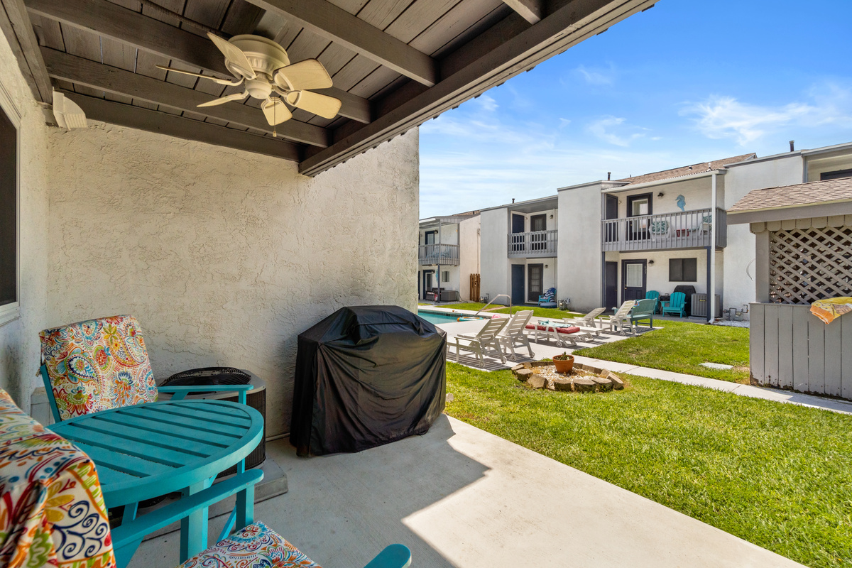 Patio with Outdoor Seating, Pool Access, and Grill. 
