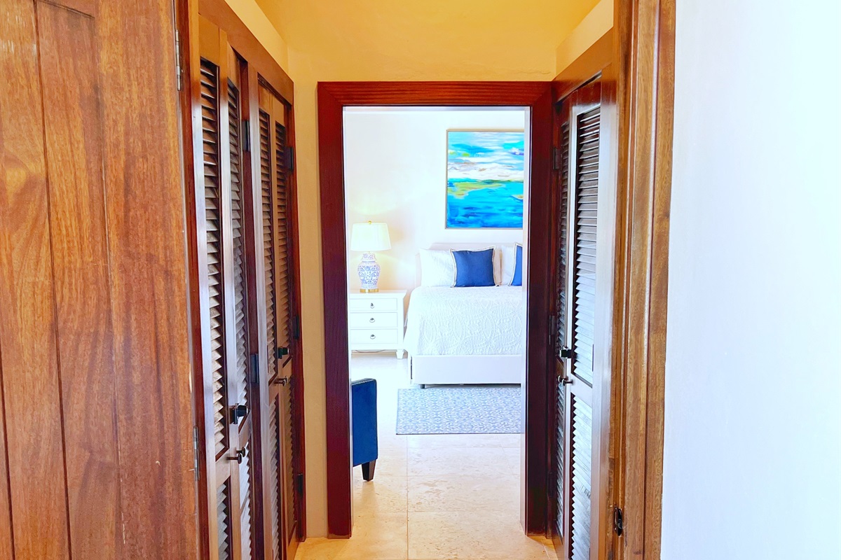 Find serenity in Bedroom with warm wood ceilings and sea breezes.