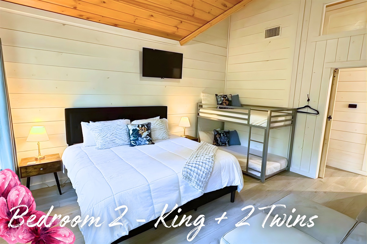 Bunk up in style! Our comfy second bedroom with a king bed and twin bunks is perfect for kids or friends sharing stories.