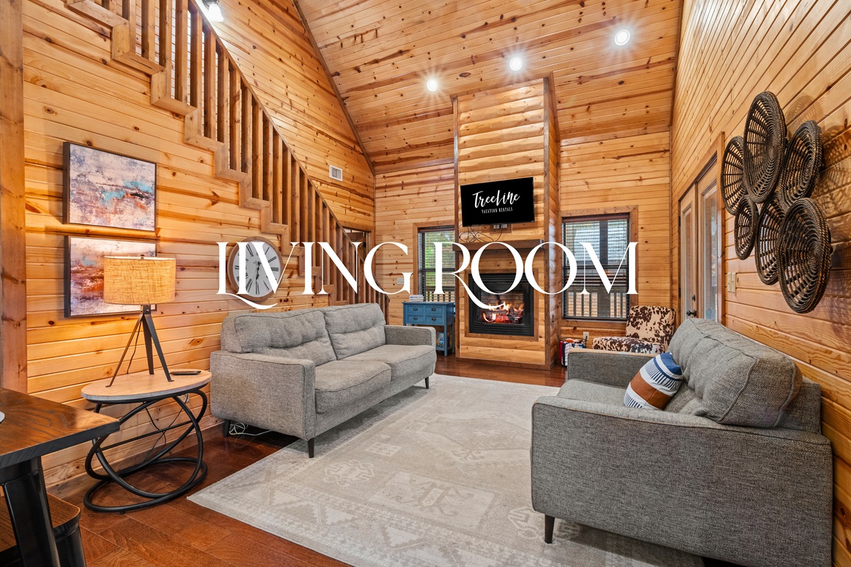 The cozy living room features comfortable seating and warm wood accents, making it easy to settle in and relax.