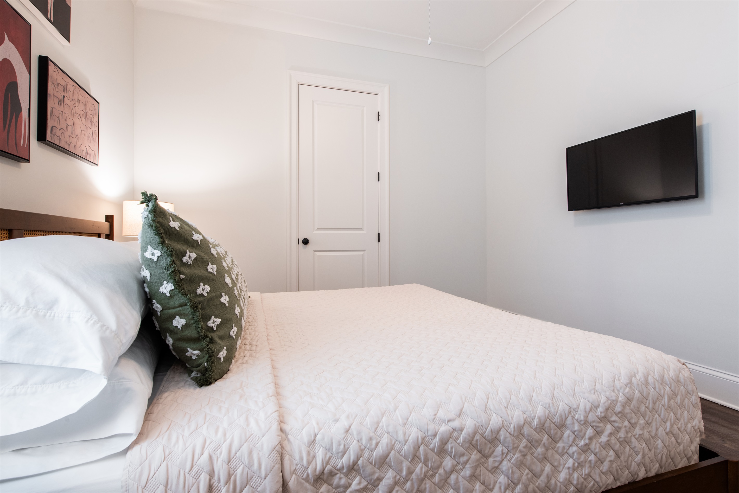 A cozy bed with soft, fluffy pillows and warm blankets, perfect for a restful night’s sleep.
