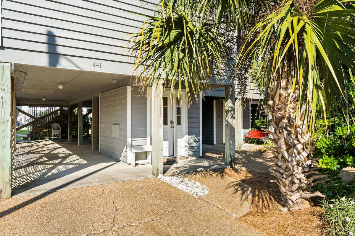 Your beach gear has a home &mdash; the carport closet keeps chairs, towels, and coolers organized so the next beach day is always ready.