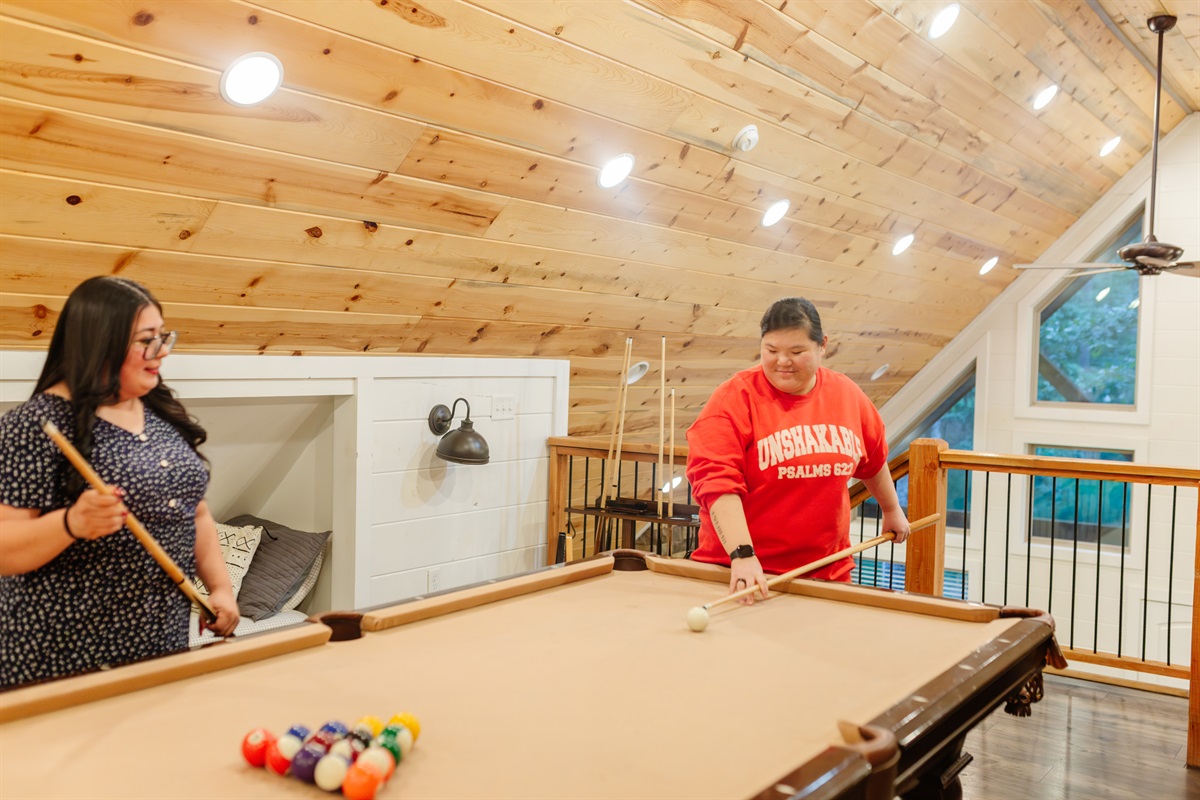 Spacious game loft with 4 twin beds—perfect for lounging, gaming & relaxing
