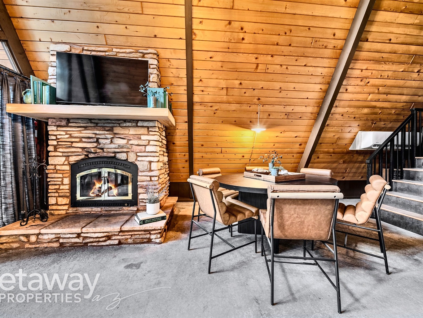 Cozy fireplace + dining space for meals and game nights