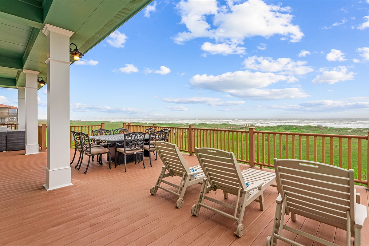 Rear Patio: Expansive deck with outdoor dining for enjoying the Gulf breeze.