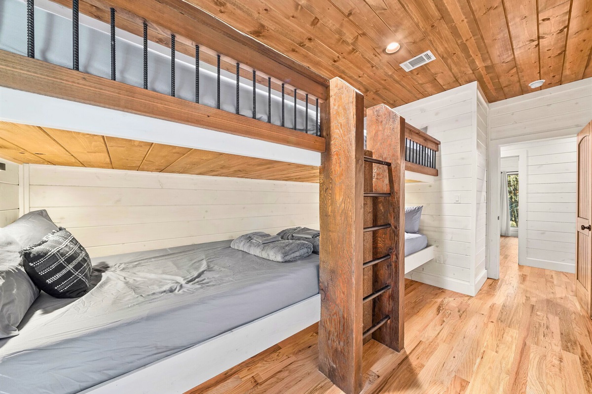 Bunkroom with built-in beds and cabin-style details.