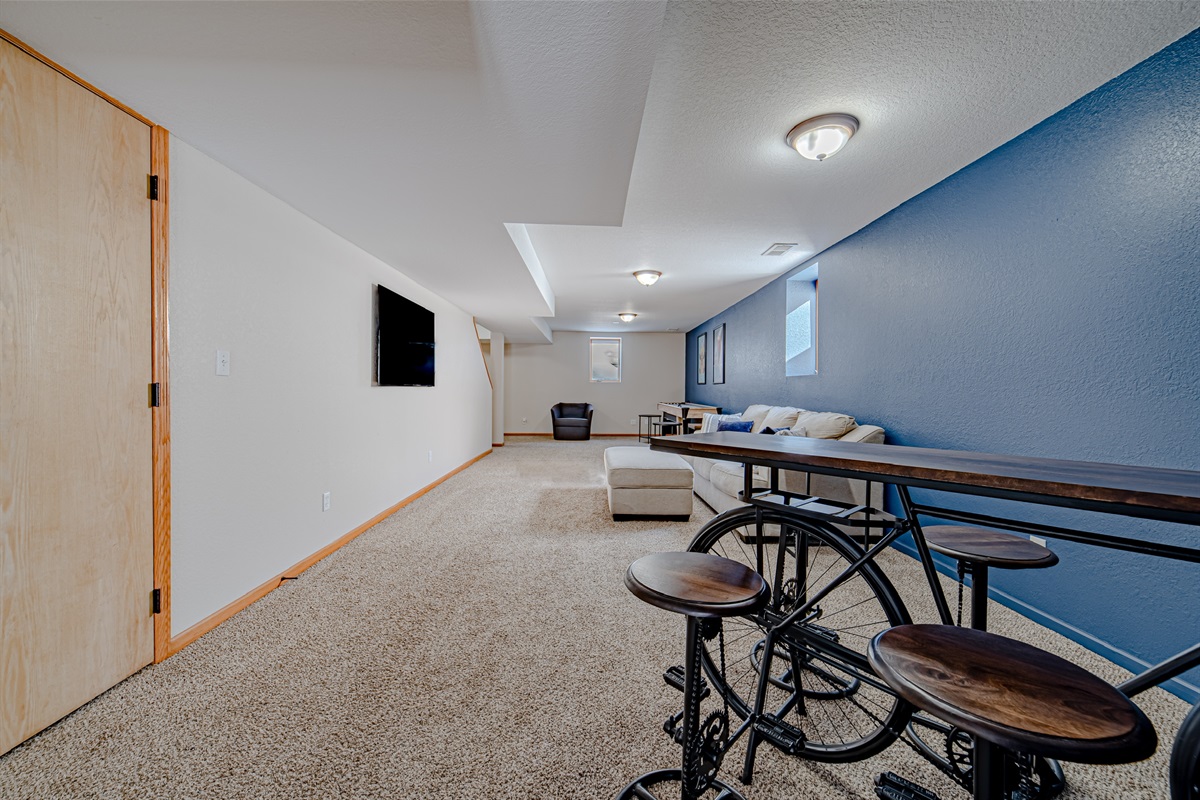 Large open space downstairs that is perfect for entertaining and a place to dodge a passing summer rain shower.