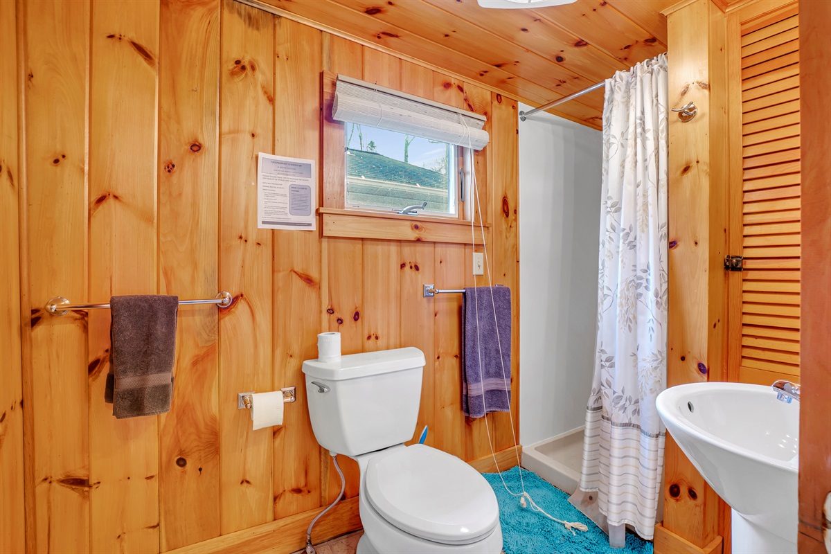 Bathroom with shower off kitchen
